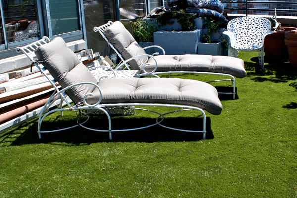 Lounge chairs on top of artificial grass on the rooftop of a Silicon Valley, CA commercial building