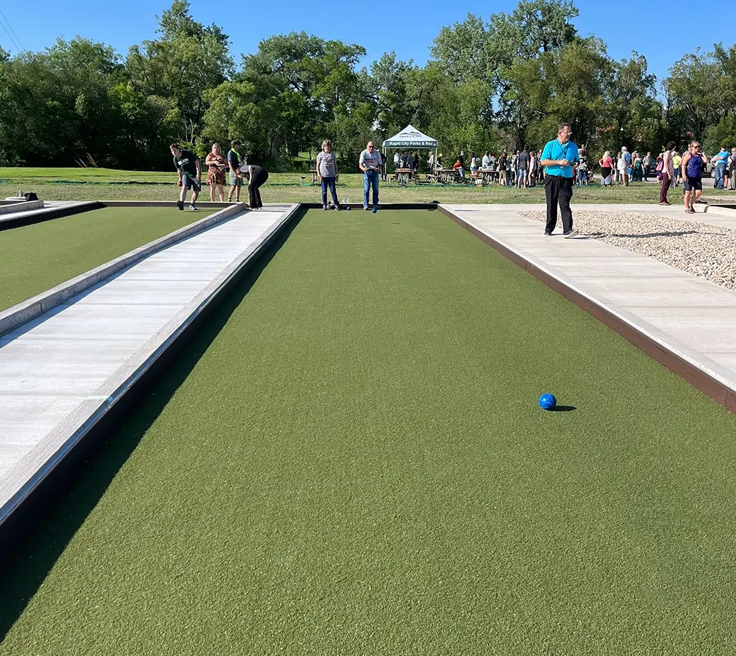 people playing on bocce ball court