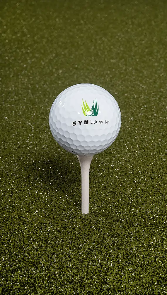 golf-ball-faq-image Golf ball teed up on artificial grass from SYNLawn